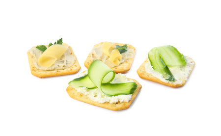 Delicious crackers with humus and cheese on white backgroundの写真素材