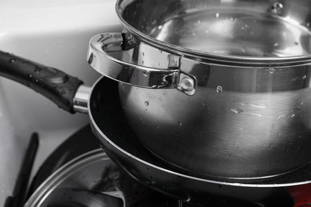 Stack of clean kitchenware in sink, closeupの写真素材