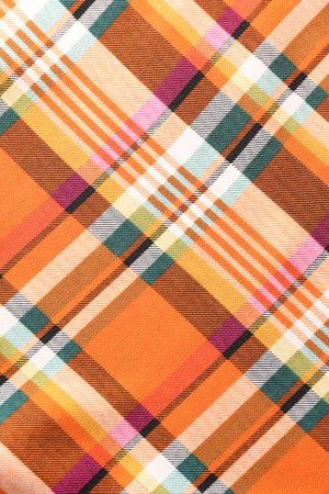 Checkered fabric with orange color as background, top viewの写真素材