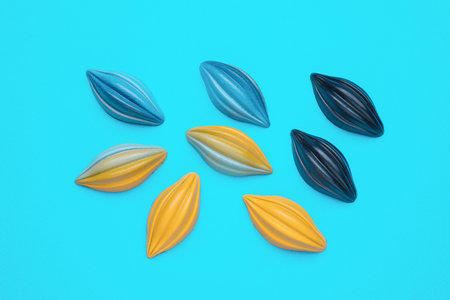 Tasty chocolate candies on light blue background, flat layの写真素材
