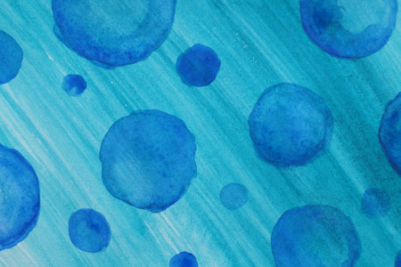 Abstract watercolor painting with blue blots as background, top viewの写真素材