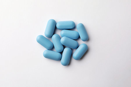 Pills on white background, top view. Potency problemの写真素材