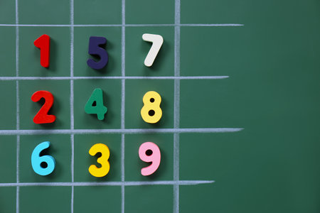Many colorful numbers on green chalkboard, flat layの写真素材
