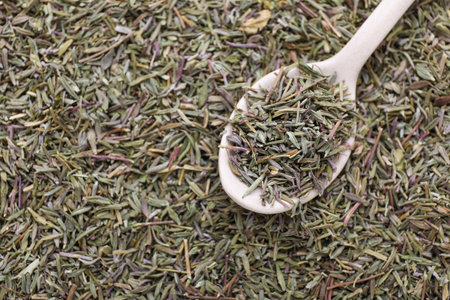 Wooden spoon with dried thyme, top viewの写真素材