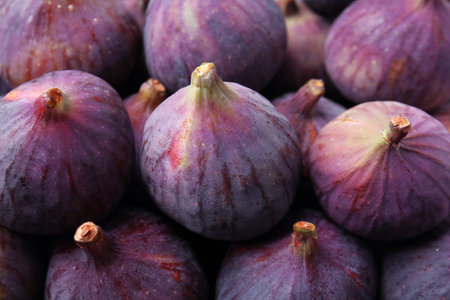 Fresh ripe figs as background, closeup viewの写真素材