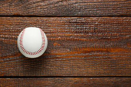 Baseball ball on wooden table, top view with space for text. Sports equipmentの写真素材