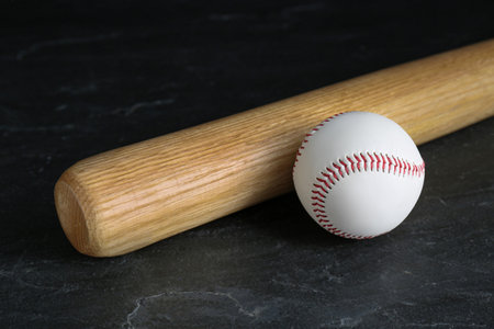 Baseball bat and ball on black background. sports equipmentの写真素材