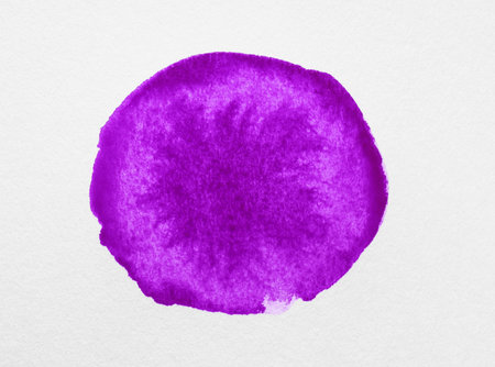 Blot of purple ink on white background, top viewの写真素材