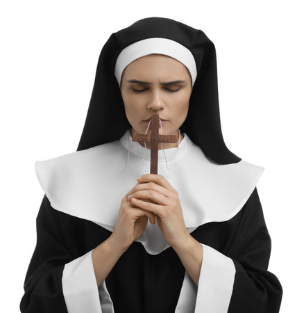 Nun holding wooden cross and praying to God on white backgroundの写真素材
