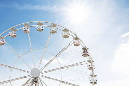 Large white observation wheel against sky, space for textの写真素材