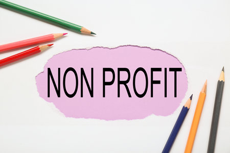 Non profit concept. Flat lay composition with colorful pencils on white backgroundの写真素材