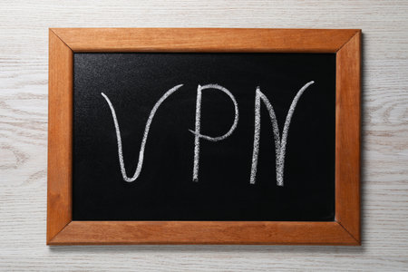 Chalkboard with VPN acronym on wooden table, top viewの写真素材