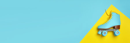 Stylish quad roller skate on color background, top view with space for text. banner design