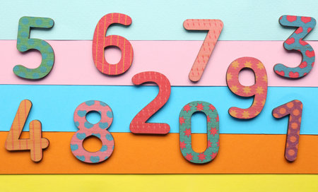 Wooden numbers on colorful background, flat layの写真素材