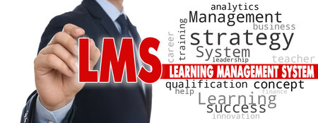 learning management system. Businessman writing abbreviation LMS on glass board, closeup. White background, banner designの写真素材