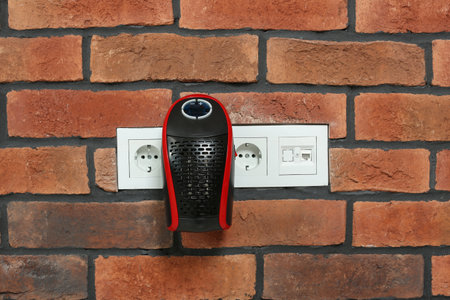 Compact electric heater charging from socket indoors