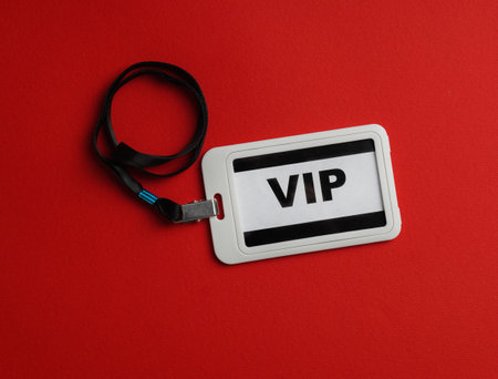 Plastic vip badge on red background, top viewの写真素材