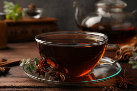 Aromatic tea with anise stars and mint on wooden table, closeupの写真素材