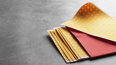 Pepper plasters on gray textured background, closeup. Space for text