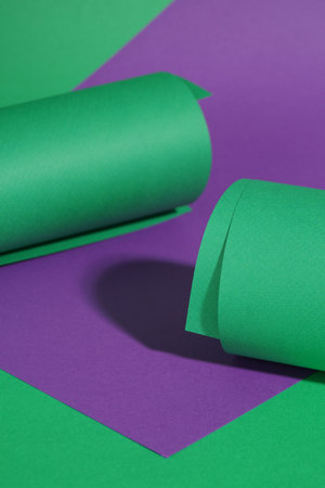 Different colorful paper sheets on green backgroundの写真素材