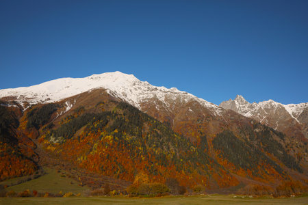 Picturesque view of beautiful high mountain under blue sky on sunny dayの写真素材