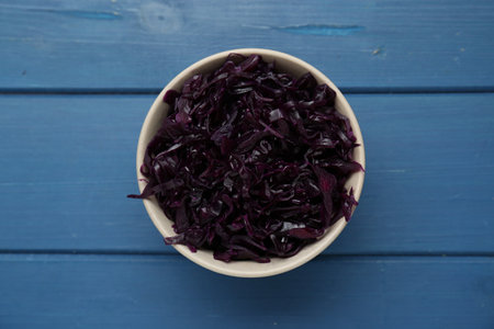 Tasty red cabbage sauerkraut on light blue wooden table, top viewの写真素材