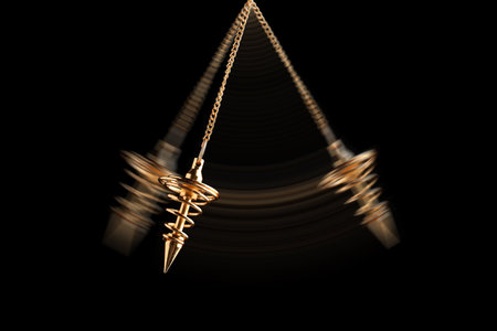 Hypnosis session. Pendant swinging on black background, motion effectの写真素材