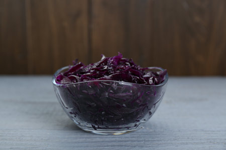 Tasty red cabbage sauerkraut on light gray wooden tableの写真素材