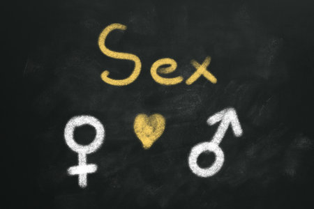 sexual education. Chalked word Sex, heart, female and male gender signs on blackboardの写真素材