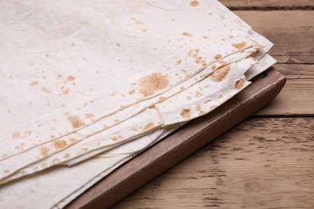 Delicious Armenian lavash on wooden table, closeupの写真素材