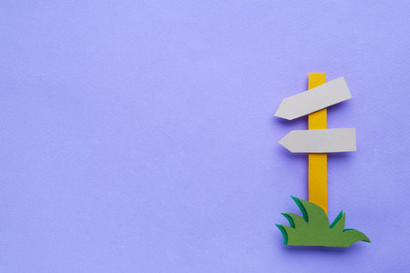 Paper signpost on purple background, top view. Space for text