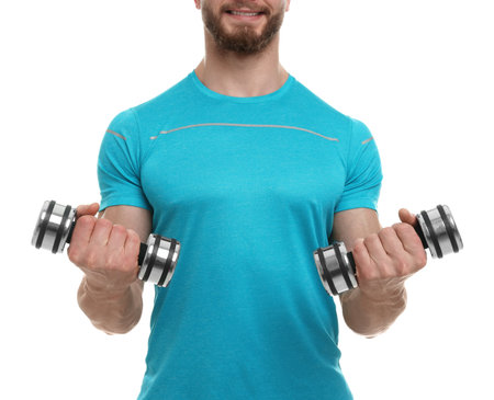 Man exercising with dumbbells on white background, closeupの写真素材