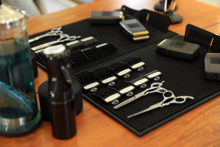 Stylish hairdresser's workplace with professional tools in barbershop, closeupの写真素材