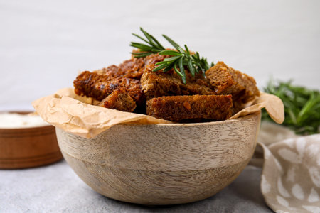 Crispy rusks with rosemary on white tableの写真素材