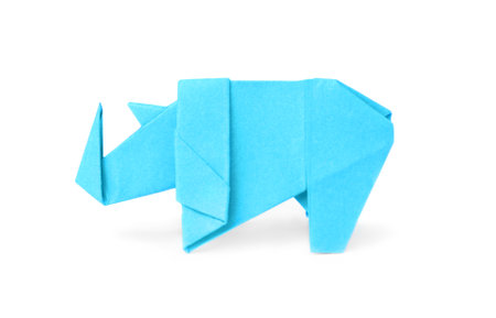 origami art. Handmade light blue paper rhinoceros on white backgroundの写真素材