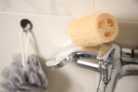 Gray shower puff and loofah sponge in bathroom, closeupの写真素材