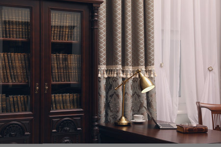 Library reading room interior with wooden bookcase and table near windowの写真素材
