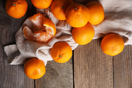 Tasty fresh tangerines on wooden table, flat layの写真素材