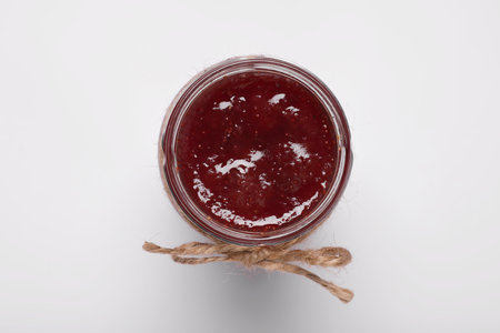 Tasty canned raspberry jam on white background, top viewの写真素材