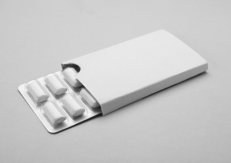 Blister with chewing gums on gray backgroundの写真素材
