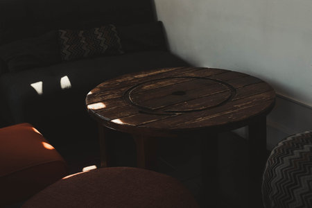 Cozy cafe interior with sofa, chairs and tableの写真素材