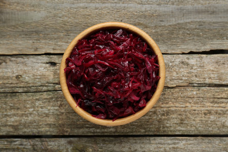 Tasty red cabbage sauerkraut on wooden table, top viewの写真素材