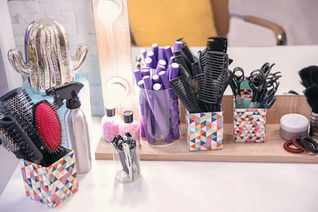 Set of hairdresser tools on table in salonの写真素材