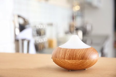 Aroma oil diffuser on table indoorsの写真素材