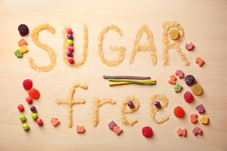 Composition with phrase SUGAR FREE on wooden backgroundの写真素材