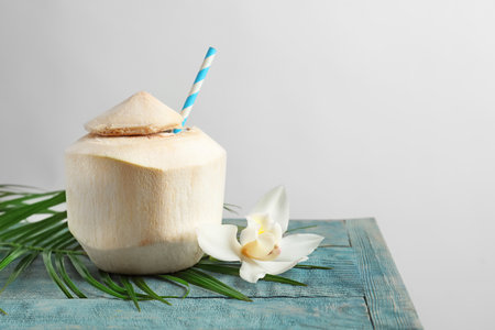 Fresh coconut drink in nut on tableの写真素材