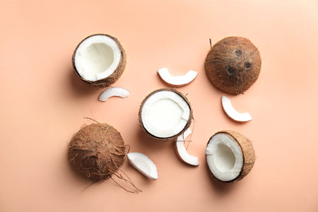 Composition with coconut milk and fresh nuts on color backgroundの写真素材
