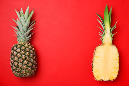 Fresh pineapples on color backgroundの写真素材