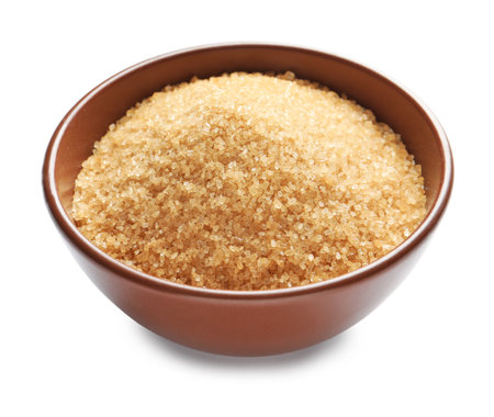 Bowl with brown sugar on white backgroundの写真素材