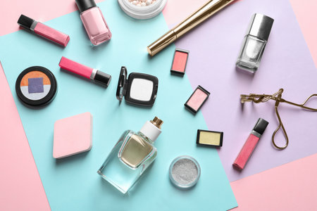 Decorative cosmetics and tools of professional makeup artist on color backgroundの写真素材